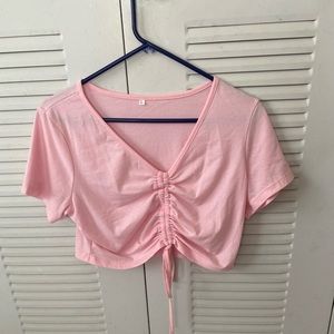 Light pink crop top with details in front